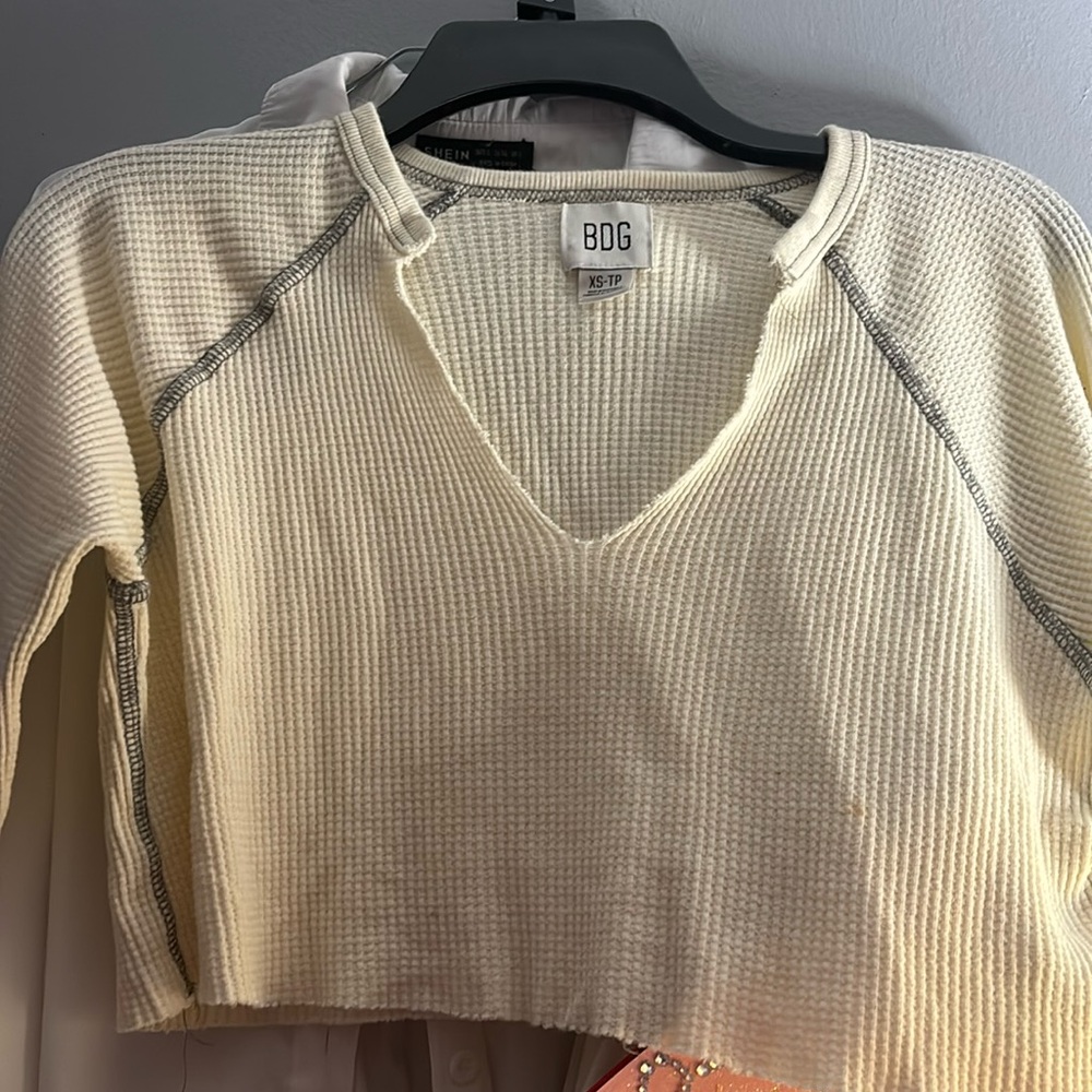 BDG cropped long sleeve, loose fitting very comfy and cute.